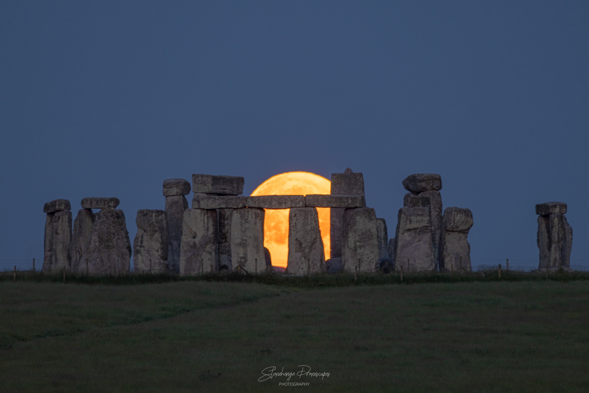 full Strawberry Moon setting at Stonehenge