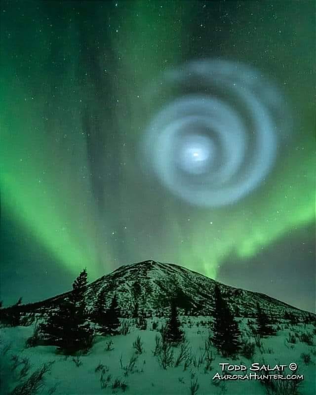 Giant spiral appears amid the Aurora lights in Alaska’s night sky
