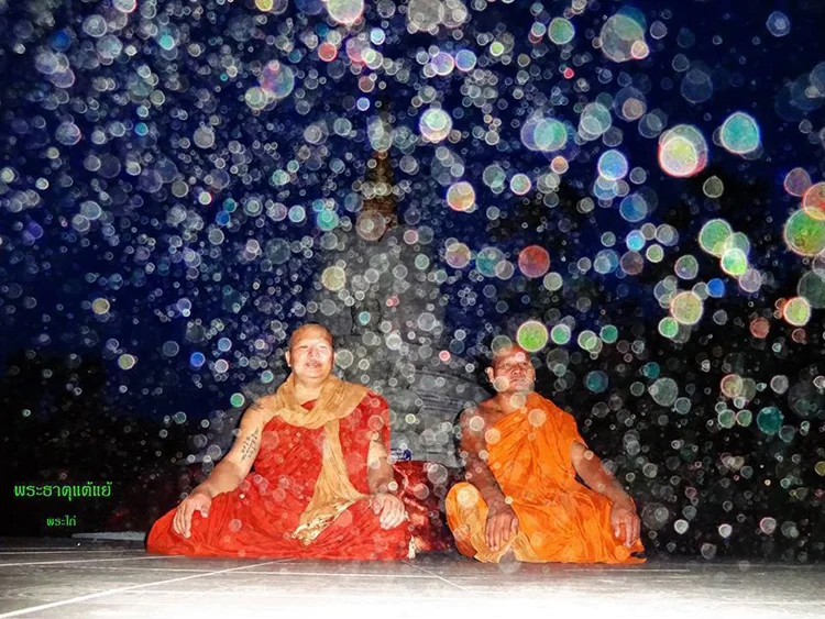 BALINESE MONKS MEDITATING AT A BUDDHIC FESTIVAL