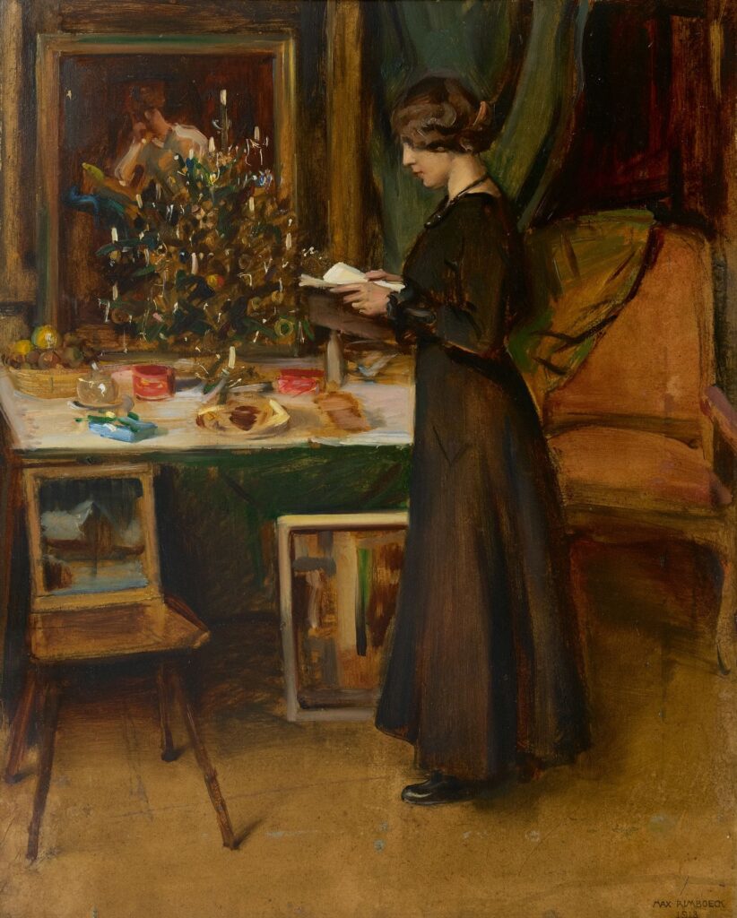 Young woman by a Christmas tree